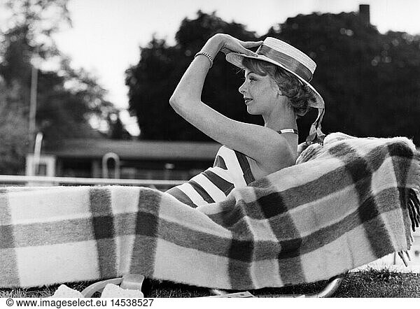 fashion  ladies' fashion  woman with straw hat lying on sunlounger  1958