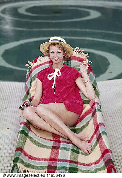 fashion  ladies' fashion  woman with straw hat lying on sunlounger  1958