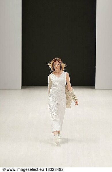 Fashion model walks the runway at fashion show in jersey clothes