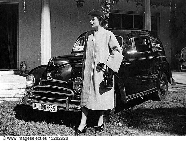 fashion  1950s  ladies' fashion  Marianne Prenzel wearing coat  handbag and cap  standing in front of a Ford Taunus G73A