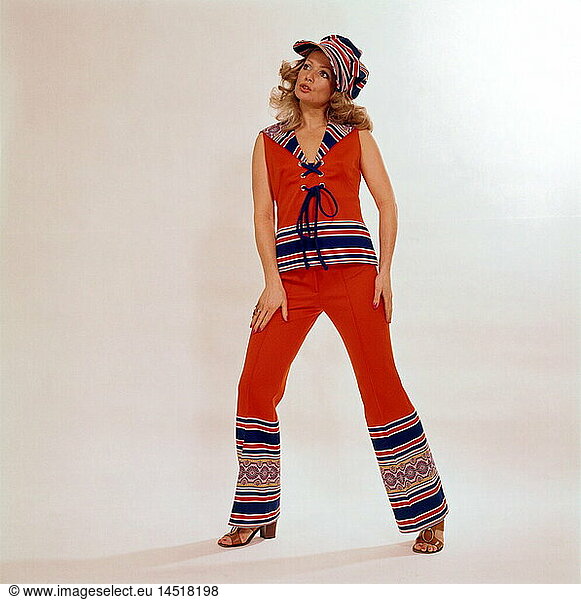fashion  1960s  woman in a combination of trousers  top and baker boy cap  full length  60s  historic  historical  orange  print  sandals  people  20th century  women  female