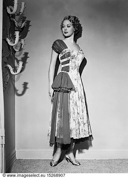 fashion  1950s  woman in summer dress made of chiffon  1950s