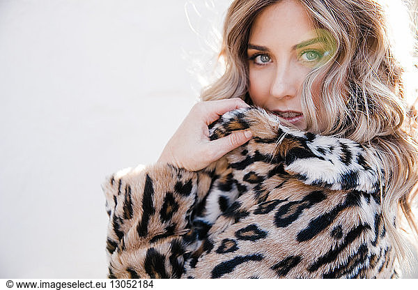 Fashionable woman in leopard print coat