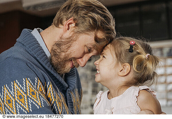 Father and daughter having fun in country club