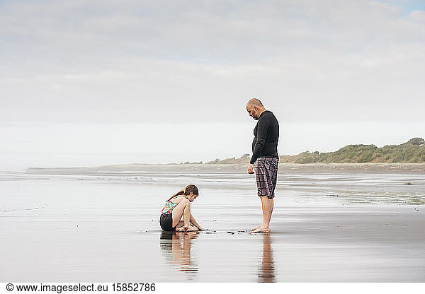 Father and daughter playing at the beach