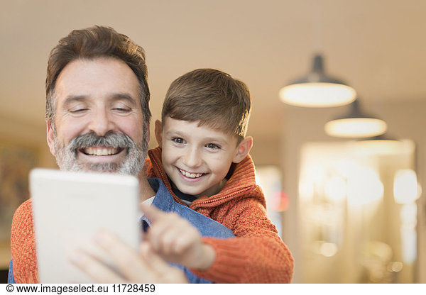 Father and son bonding  sharing digital tablet