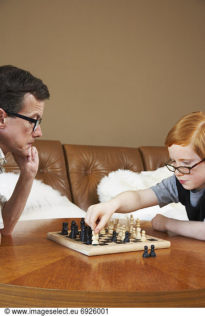Father and Son Playing Chess