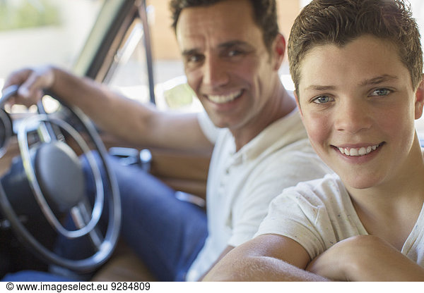 Father and son riding in car together