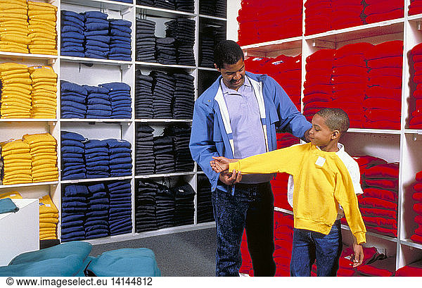Father helps son shop