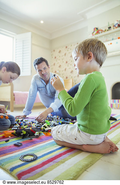 Father playing with children