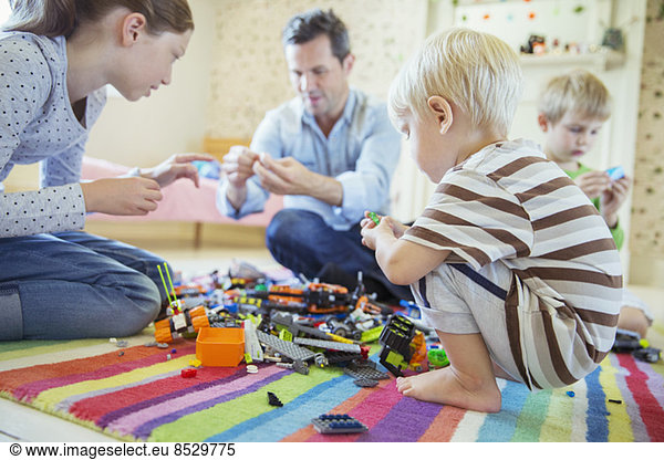 Father playing with children