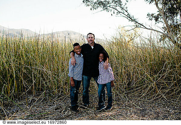 Father Posing with Sons at Park in Chula Vista
