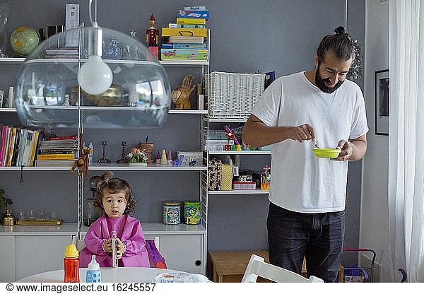Father with daughter at home