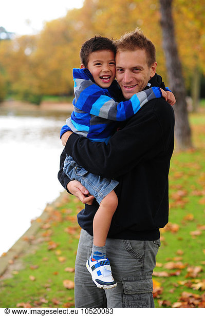 Father with his son in his arms.