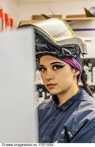 Female Auto worker prepping paint
