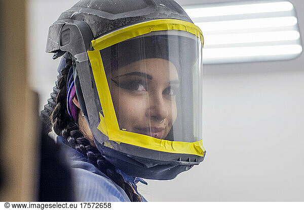 Female Auto worker with helmet mask on