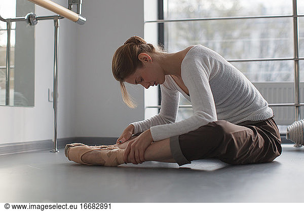 female ballet dancer relaxing after dance