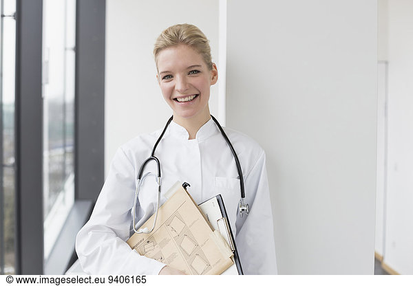Female doctor holding file