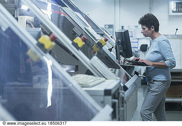 Female engineer working on computer in industry  Hanover  Lower Saxony  Germany