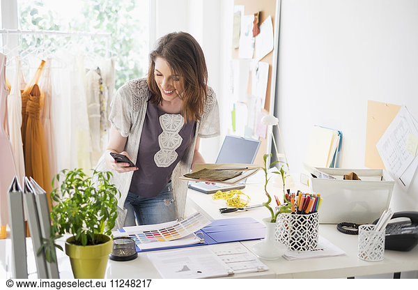 Female fashion designer in her office
