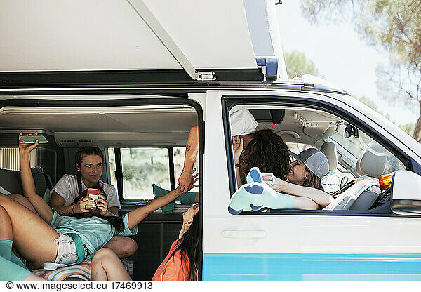 Female friends having fun in camper van