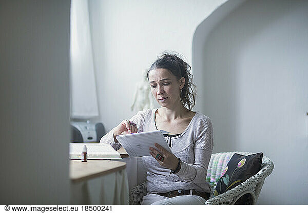 Female healer checking the index card  Freiburg im Breisgau  Baden-Württemberg  Germany