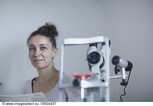 Female healer with microscope  Freiburg im Breisgau  Baden-Württemberg  Germany