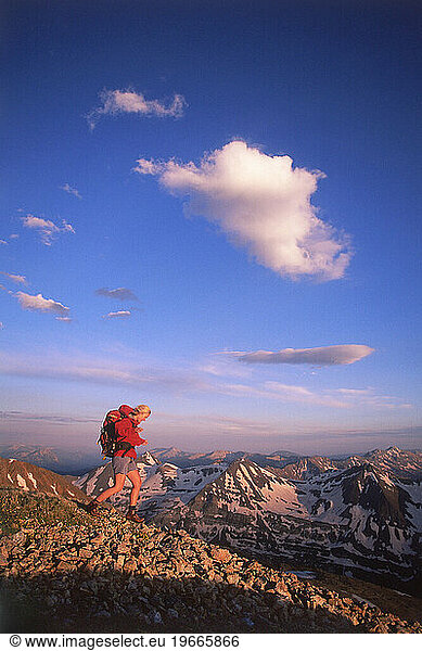 Female hiker at sunset at 13 000 feet on Mountain  Colorado.