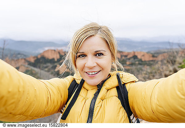 Female hiker taking a selfie at Mina de Oro Romana  Las Medulas  Castile and Leon  Spain