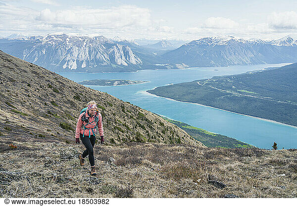 Female Hiker Walking Ridge of Nares Mountain