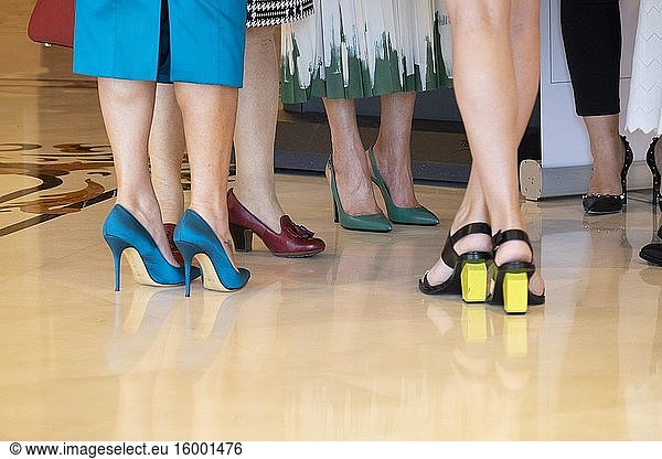 Female legs with haute couture shoes.