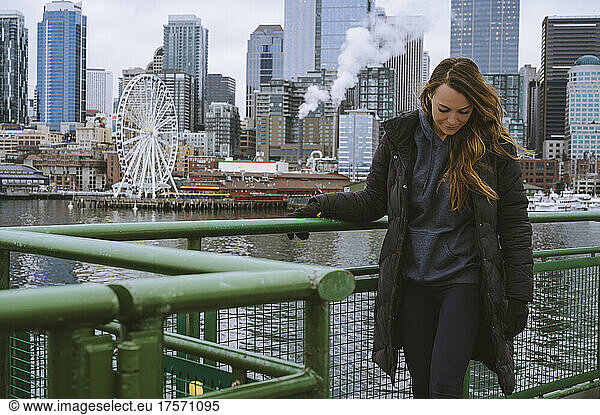Female on a ferry boat with Seattle waterfront in the background