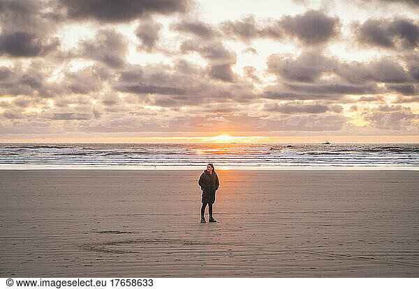 Female posing on the beach at sunset on The Oregon Coast