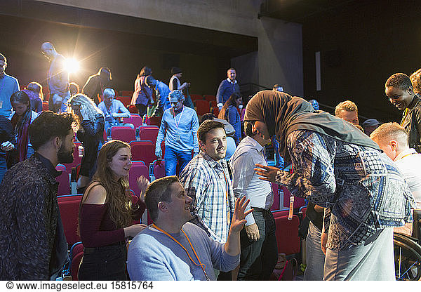 Female speaker in hijab talking to audience