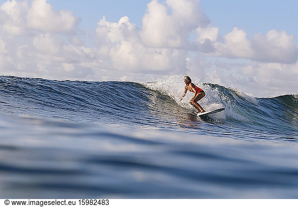 Female surfer on surfboard