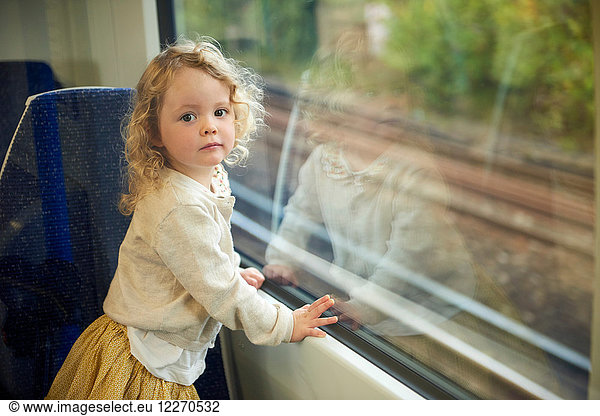 Female toddler on train  portrait