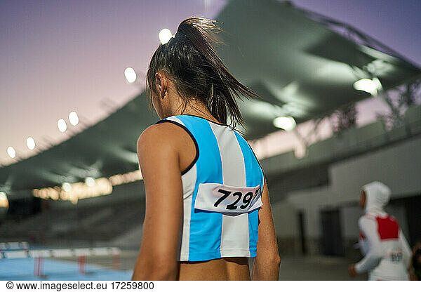 Female track and field athlete preparing for competition