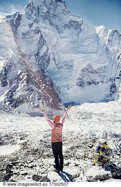Female trekker enjoying the view of the Mount Everest Summit