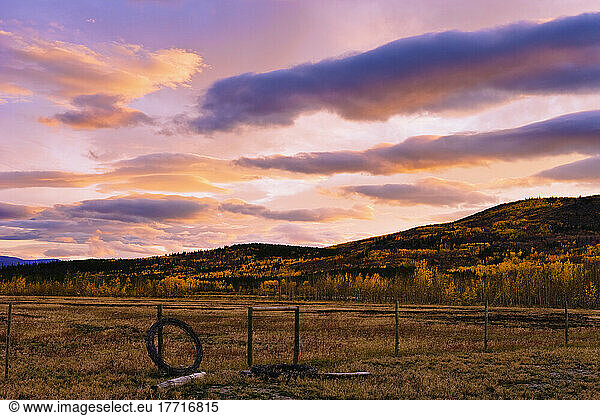 Fence And Cloud Formation At Dusk  Yukon