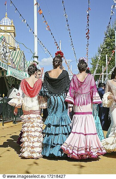 Feria de Abril  woman in flamenco dresses  traje de gitana  marquee  Seville  Andalusia  Spain  Europe