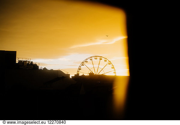 Ferris wheel at sunrise  Galway  Ireland