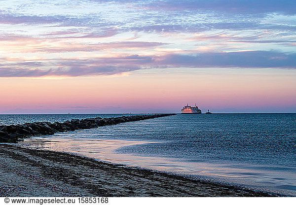 Ferry entering the harbor at sunset.