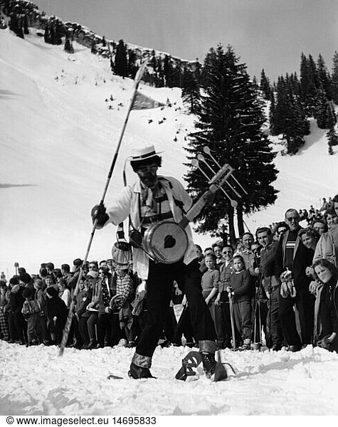 festivities  carnival  carnival on skis  costumed skier with mandolin on slope  Firstalm  Schliersee  1957
