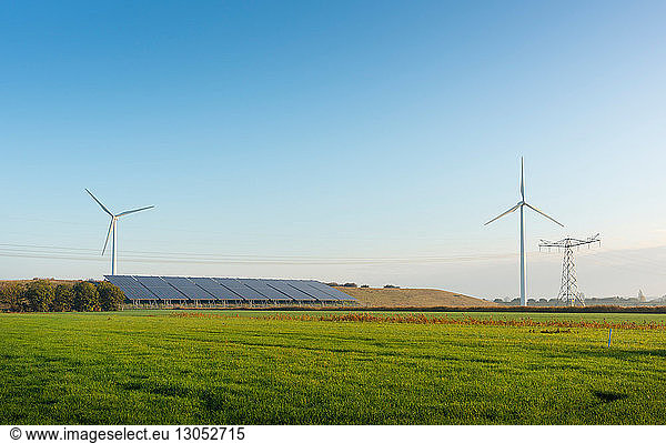Field landscape with wind turbines and solar farm located on a former waste dump in autumn  Netherlands