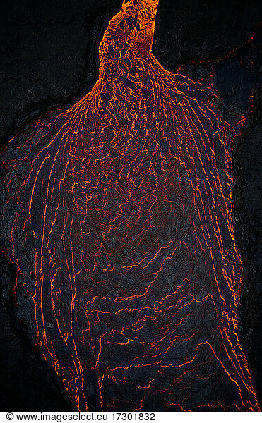 Fiery volcanic lava in darkness