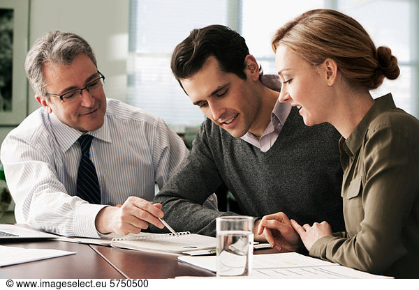 Financial advisor meeting with young couple