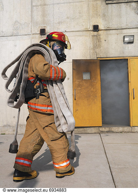 Firefighter Outside of Smoke-filled Building