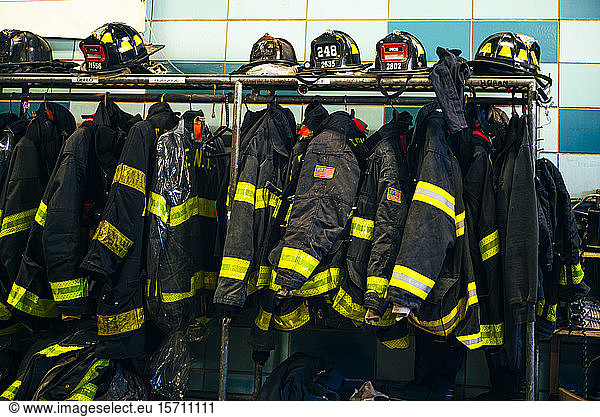 Firefighter uniforms and helmets in fire station  New York  United States
