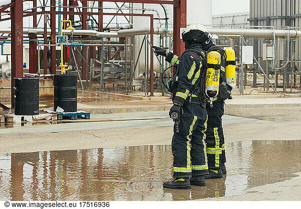 Firefighters talking in a training session. Solar thermal plant.