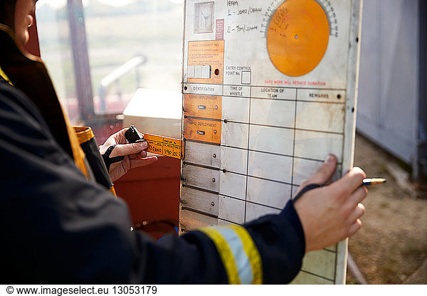 Fireman looking at chart at training centre
